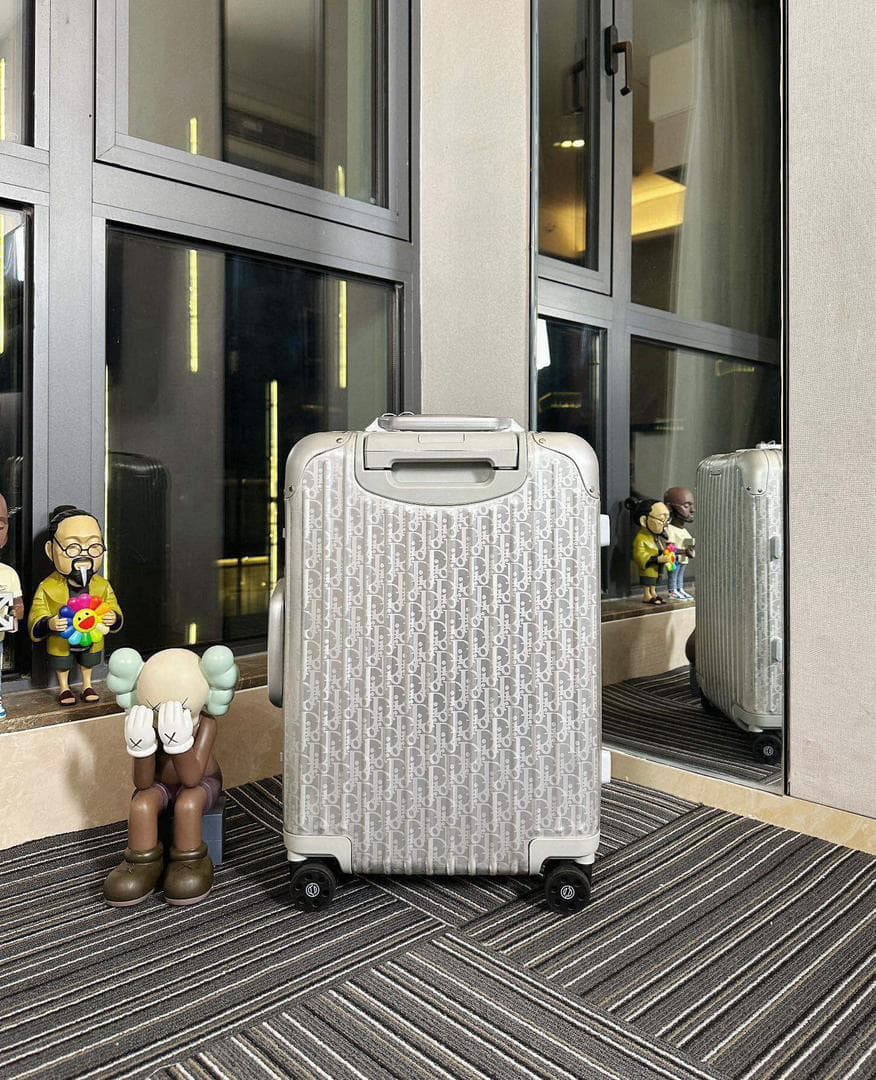 Mala Dior And Rimowa Carry-On Suitcase