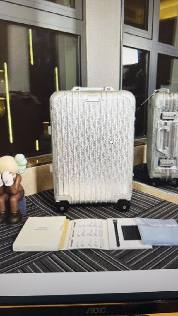 Mala Dior And Rimowa Carry-On Suitcase